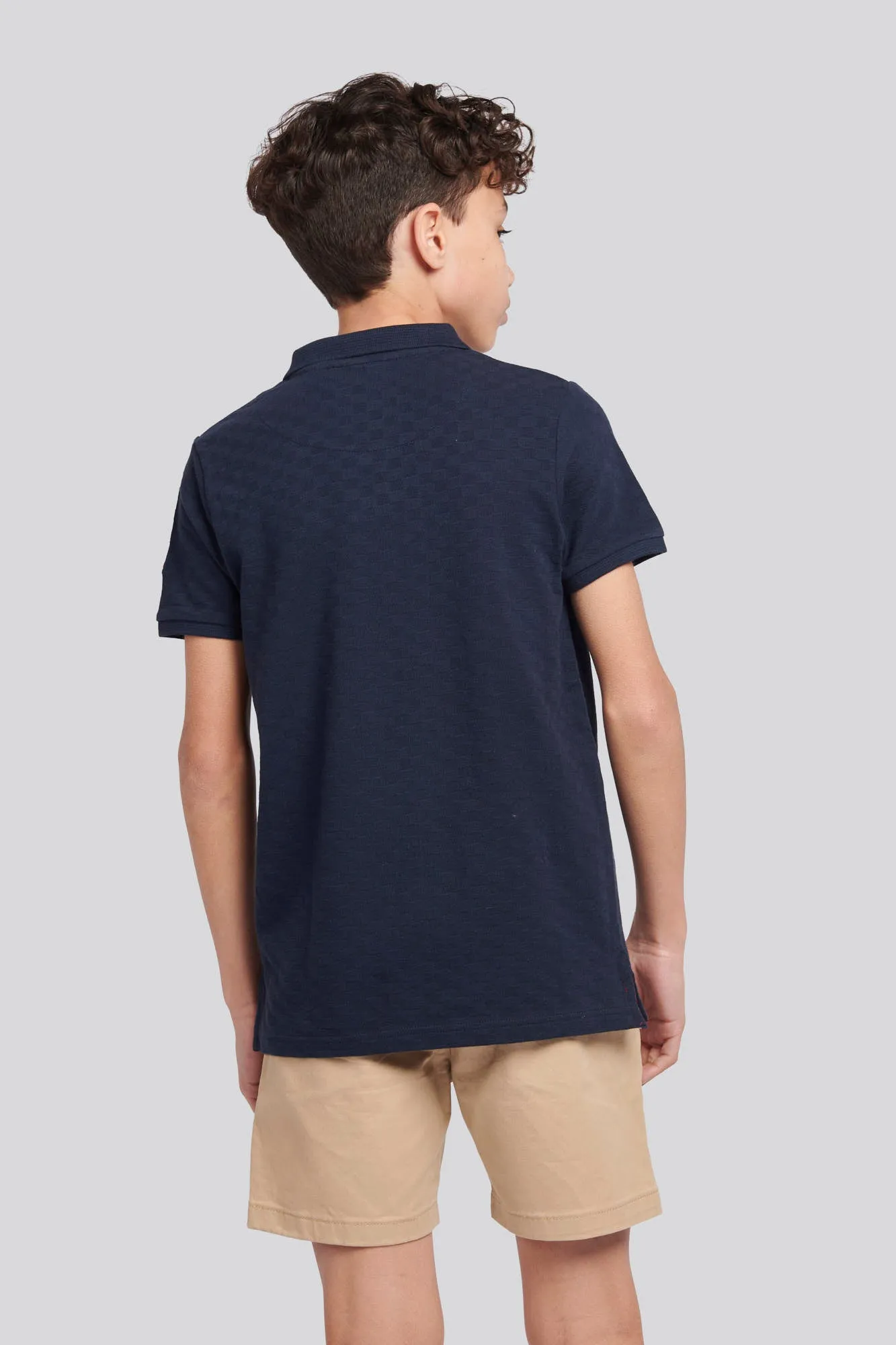 Boys Check Texture Polo Shirt in Dark Sapphire Navy / Haute Red DHM